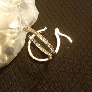Silver hoop CX accent earrings